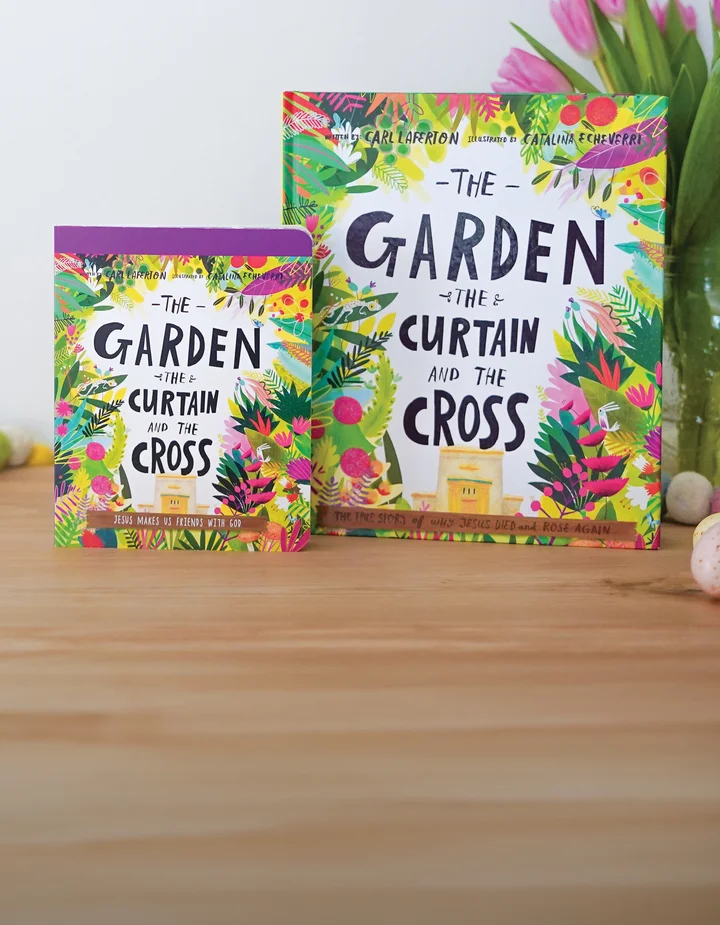 Photograph of The Garden The Curtain and the Cross board book and storybook propped up on a wooden surface