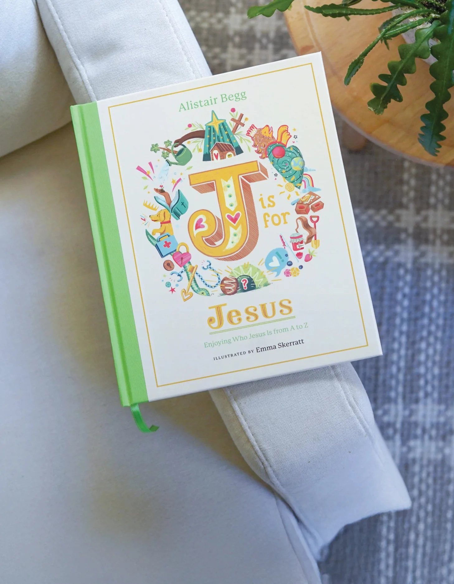 Photograph of J is for Jesus on the arm of a chair