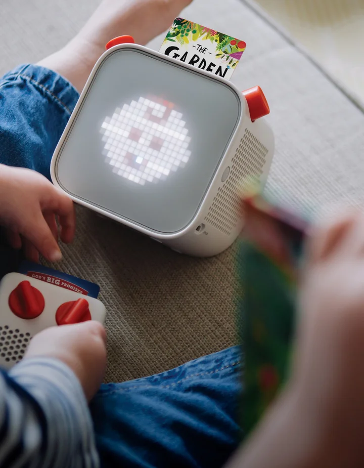 Photograph of a Yoto player with The Garden, the Curtain and the Cross and Other Stories card