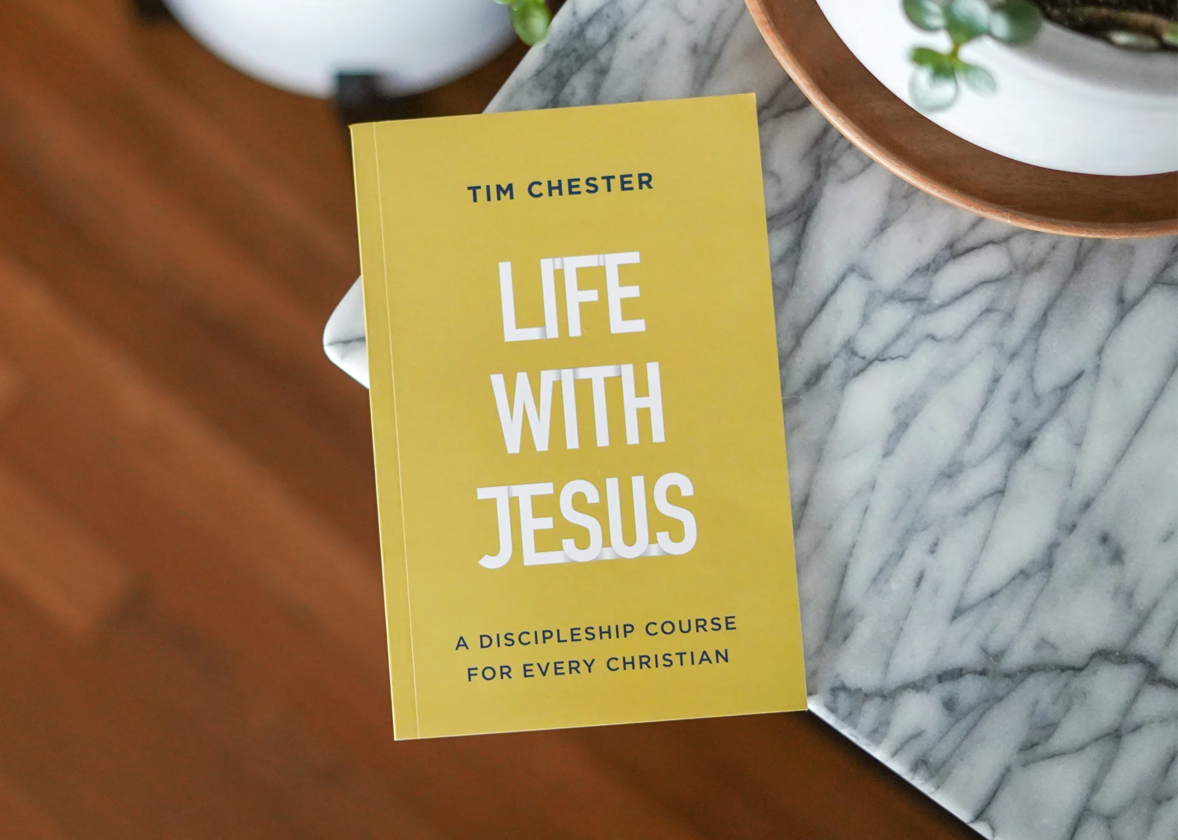Photograph of someone holding an e-reader with An Incredible True Story of the Power of the Local Church by Ellen Vaughn